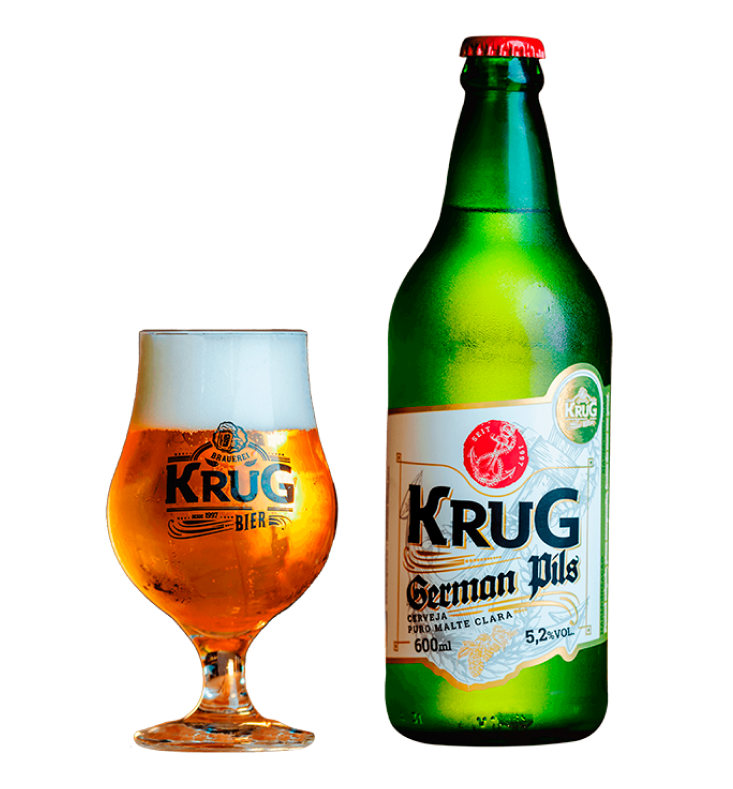 Garrafa e taça de Krug German Pils, cerveja dourada clara com colarinho denso